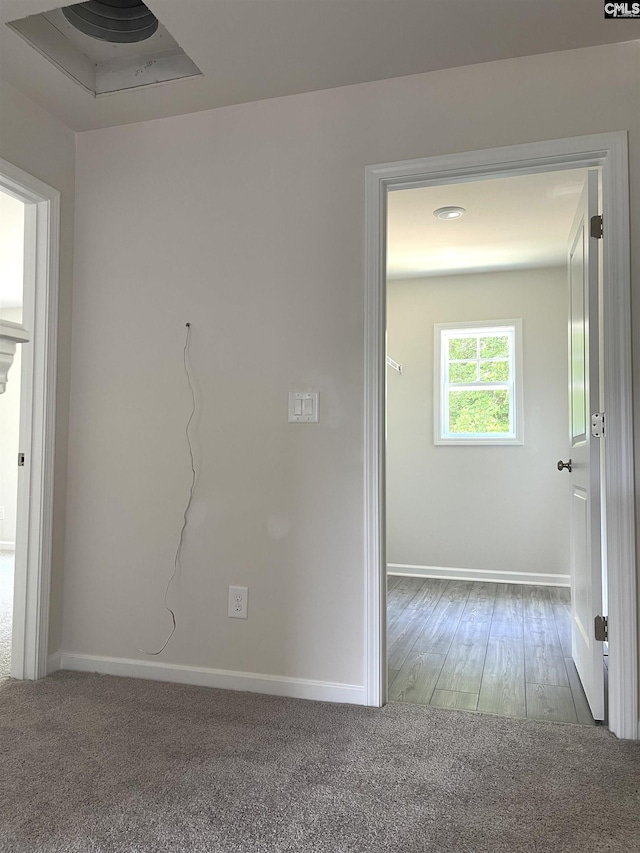 empty room with carpet and baseboards