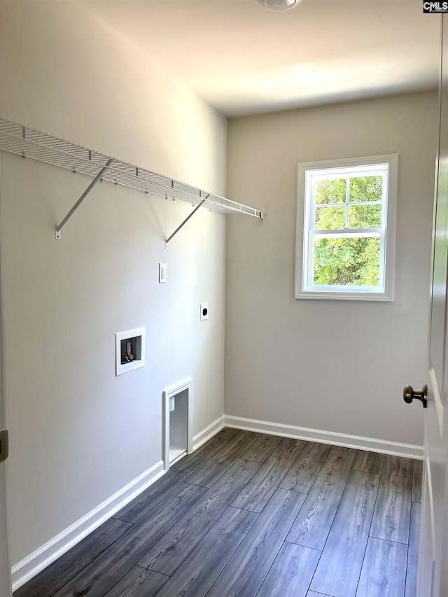 washroom with dark wood-style floors, washer hookup, hookup for an electric dryer, laundry area, and baseboards