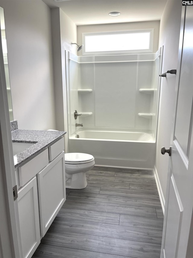 full bathroom featuring toilet, shower / washtub combination, a wealth of natural light, and vanity