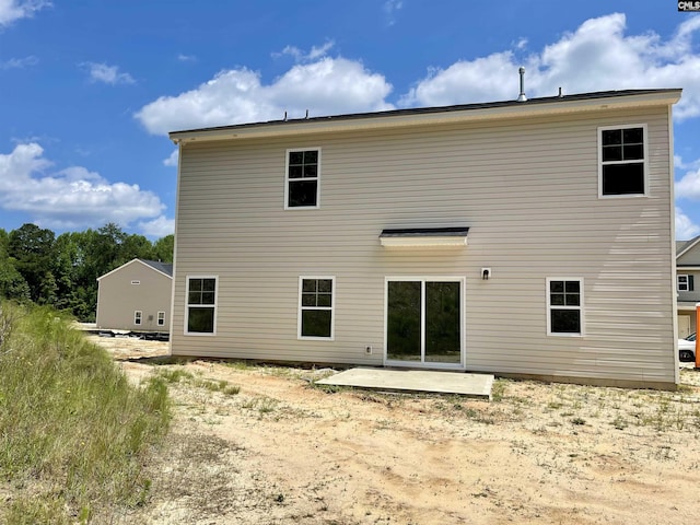 back of property featuring a patio