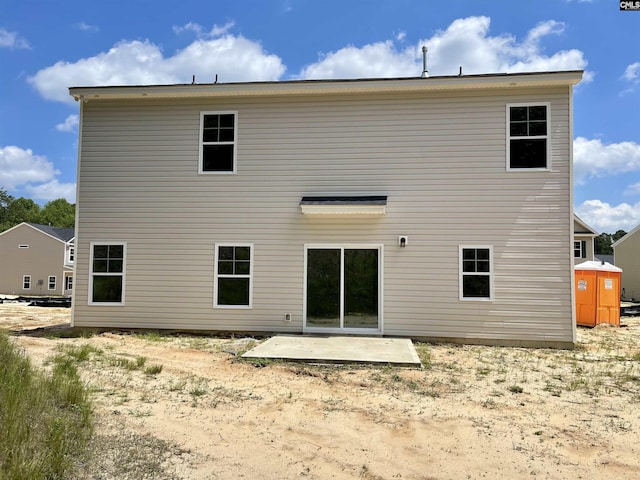 rear view of house with a patio