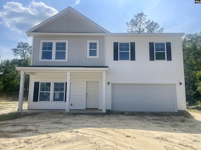 view of front of home featuring a garage, driveway, and board and batten siding