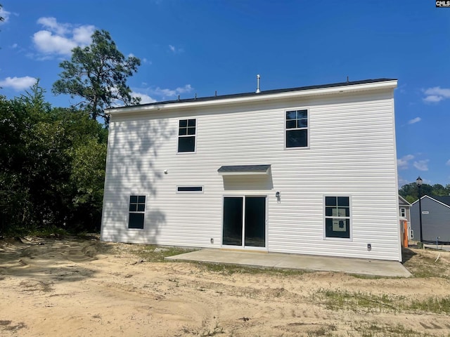 back of property featuring a patio area