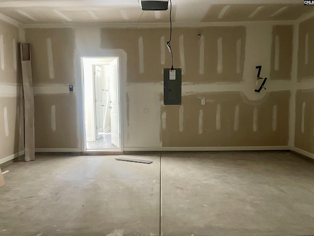 garage with electric panel and a garage door opener