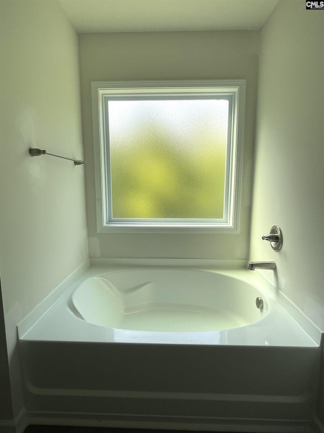 full bath with a garden tub