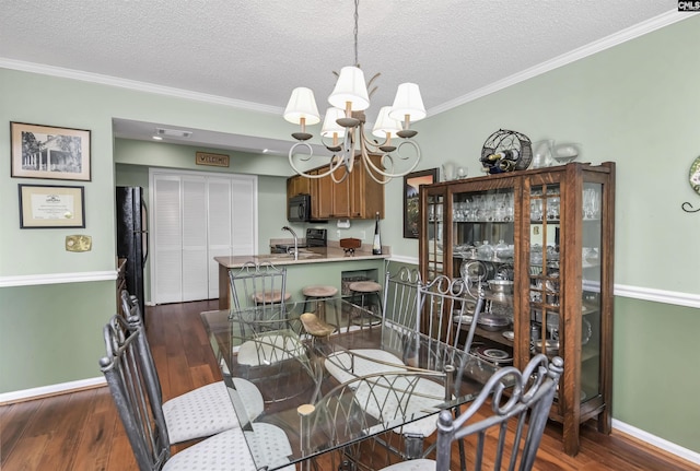 dining space featuring crown molding, dark wood-type flooring, baseboards, and an inviting chandelier