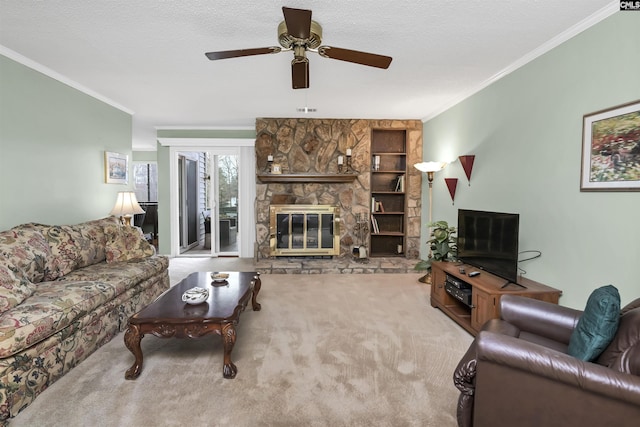 living room with a ceiling fan, a stone fireplace, a textured ceiling, crown molding, and carpet floors