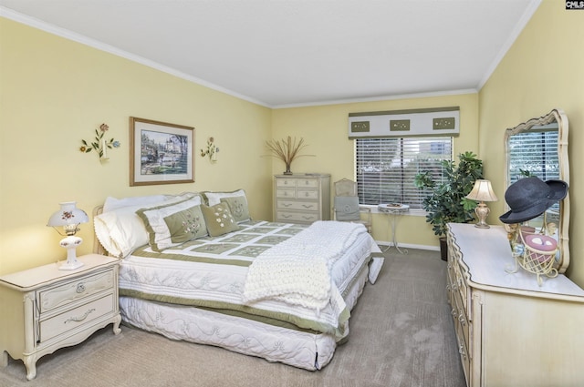 bedroom with baseboards, carpet flooring, and crown molding