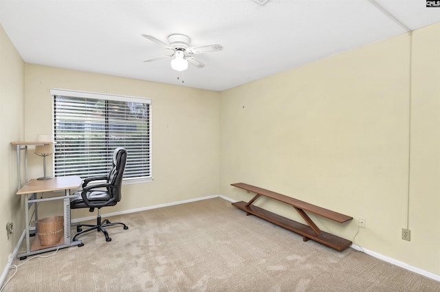 office with a ceiling fan, carpet, and baseboards