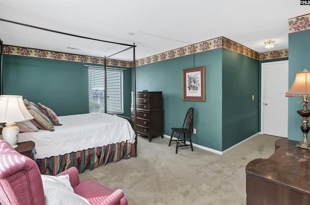 carpeted bedroom featuring baseboards