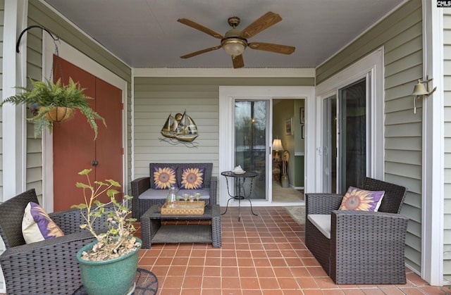 sunroom / solarium featuring ceiling fan