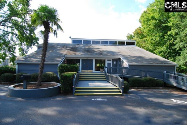 view of front of property featuring a deck