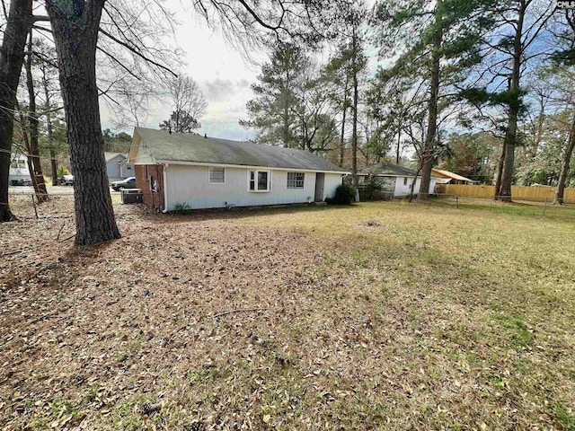 exterior space with a yard and fence