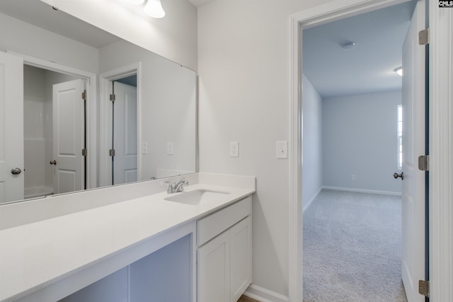 bathroom featuring vanity and baseboards