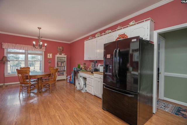 kitchen featuring light wood-style floors, white cabinets, and black refrigerator with ice dispenser