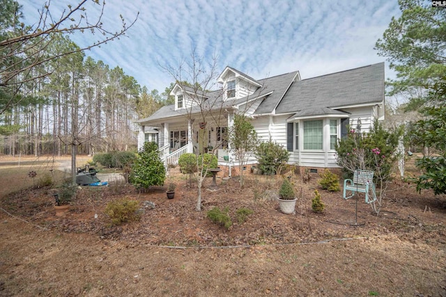 cape cod-style house featuring a porch and crawl space