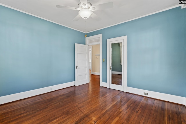 unfurnished room featuring crown molding, a ceiling fan, hardwood / wood-style flooring, and baseboards