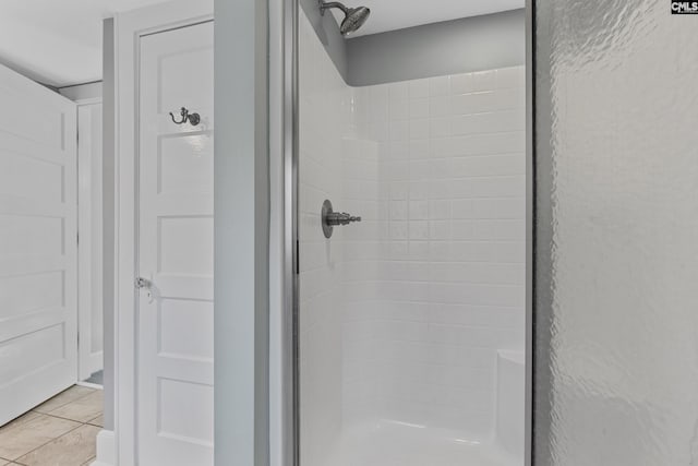 bathroom featuring a stall shower and tile patterned floors