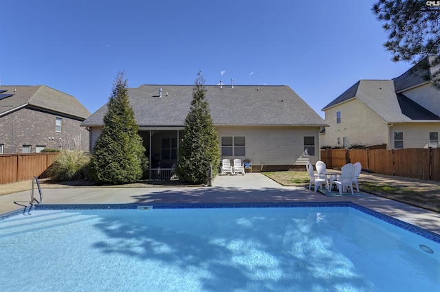 view of swimming pool with a fenced backyard, a fenced in pool, and a patio