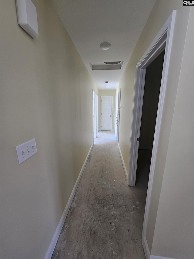 corridor featuring baseboards