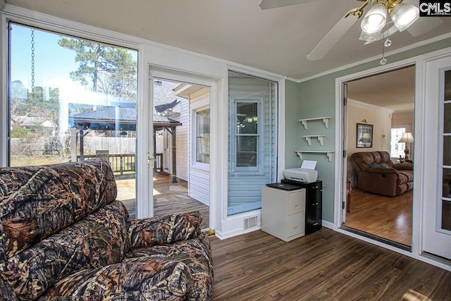 sunroom / solarium with ceiling fan