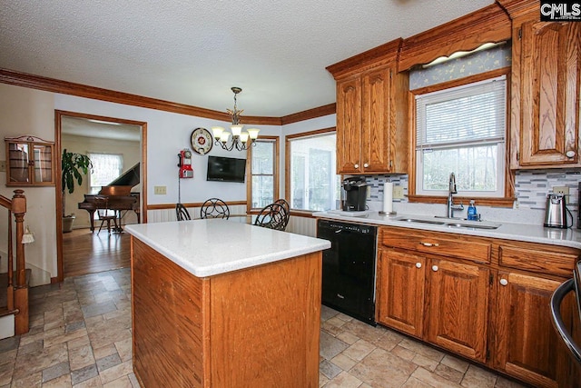 kitchen with dishwasher, a sink, stone tile flooring, and a center island