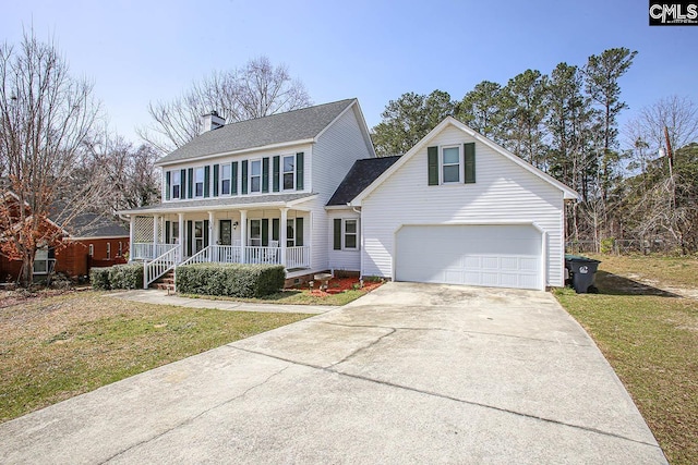 colonial home with driveway, a garage, a porch, and a front yard