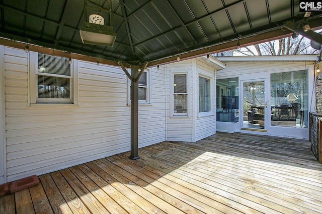 deck with a sunroom and a gazebo