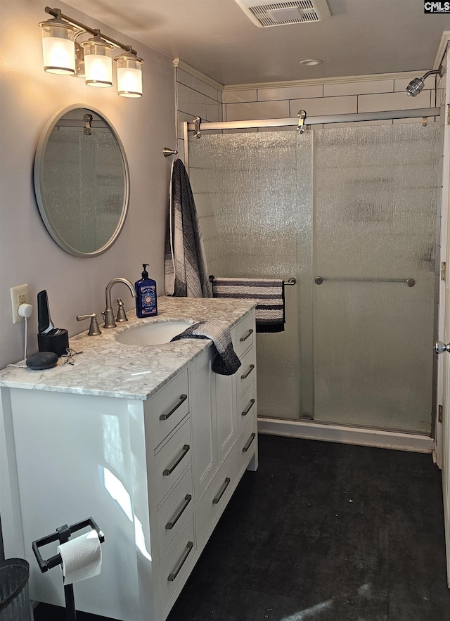 full bath with a stall shower, visible vents, and vanity