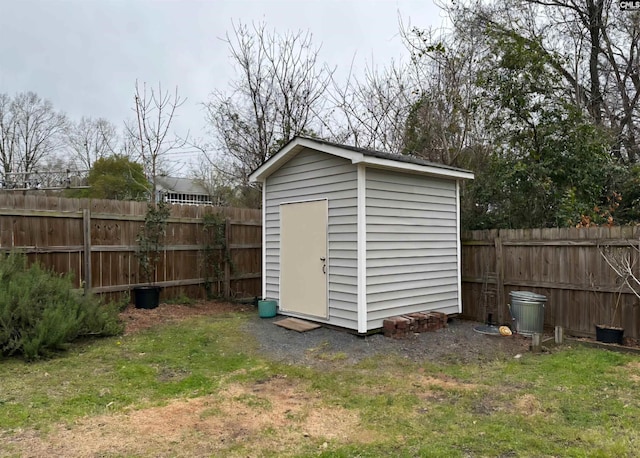 view of shed with a fenced backyard