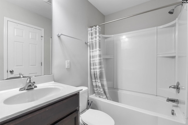 full bathroom featuring shower / bath combo with shower curtain, toilet, and vanity