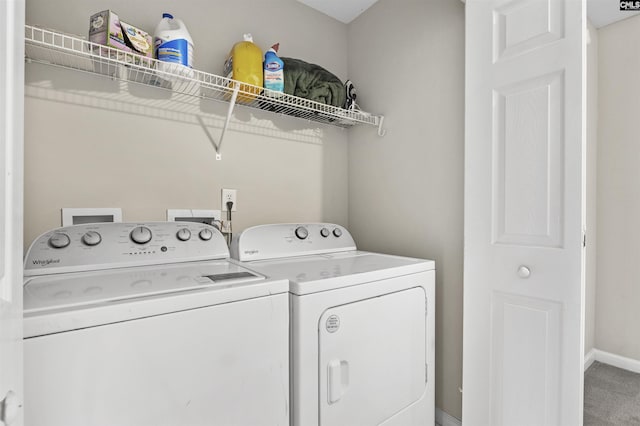 laundry room with washer and dryer, baseboards, carpet floors, and laundry area