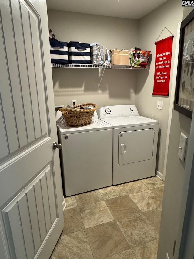 washroom with washer and dryer and laundry area