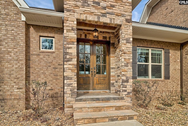 entrance to property with french doors and brick siding