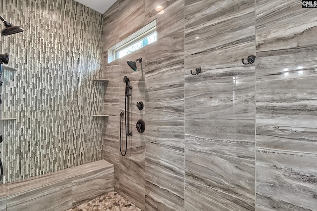 full bath with tiled shower