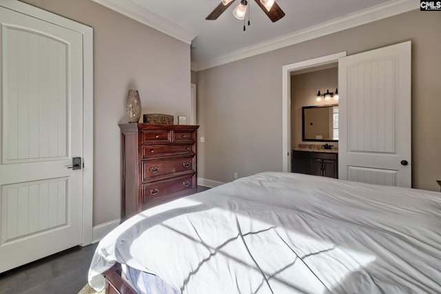 bedroom featuring ornamental molding, connected bathroom, dark wood finished floors, and baseboards