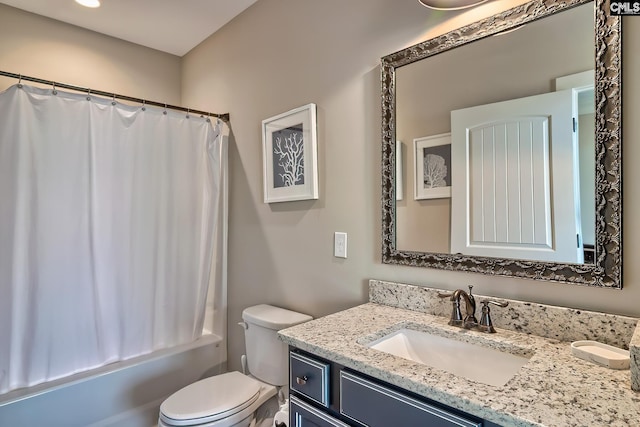 bathroom with toilet, shower / bath combo, and vanity