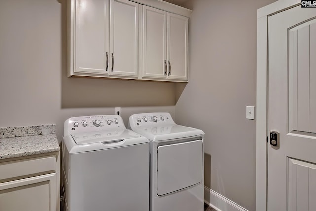 laundry area with cabinet space and washer and clothes dryer