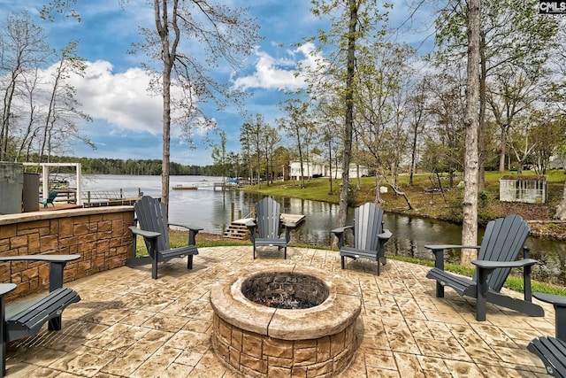 view of patio featuring a fire pit and a water view