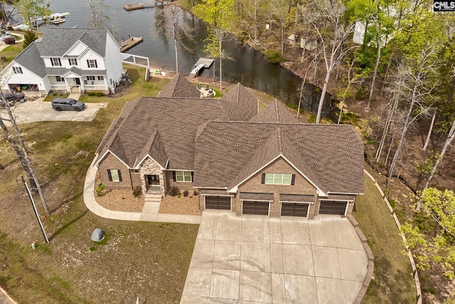 birds eye view of property featuring a water view