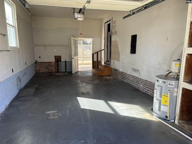 garage featuring a garage door opener and water heater