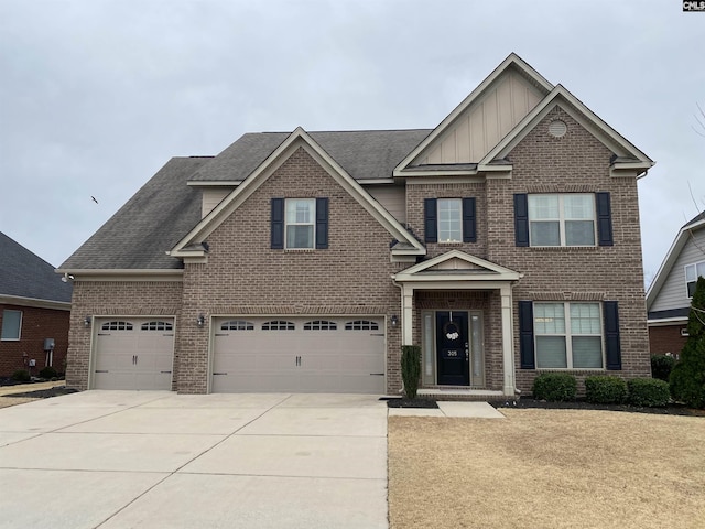 view of front facade with board and batten siding, brick siding, driveway, and a garage