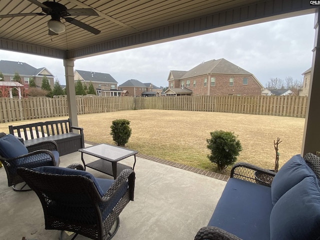 view of patio with ceiling fan, a residential view, an outdoor hangout area, and a fenced backyard