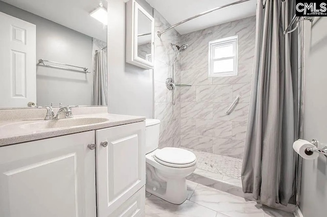 full bath featuring marble finish floor, tiled shower, vanity, and toilet