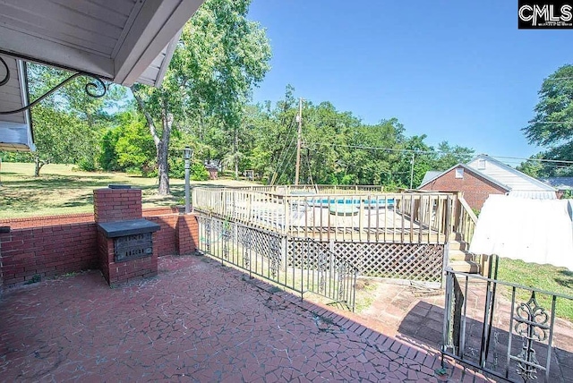 view of patio / terrace featuring a wooden deck