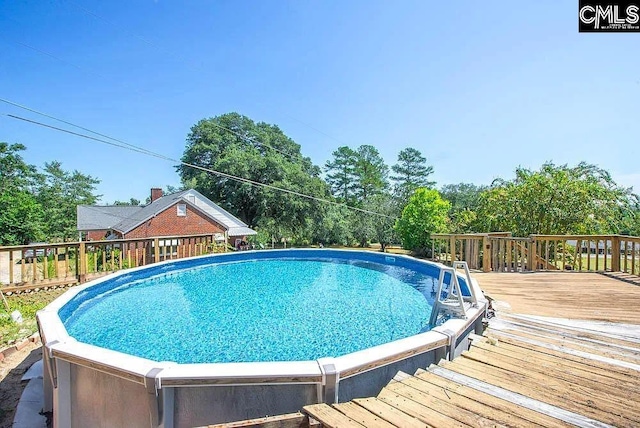 pool featuring a wooden deck