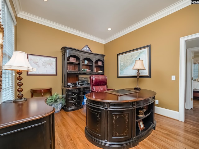 office space featuring ornamental molding, light wood-type flooring, and baseboards