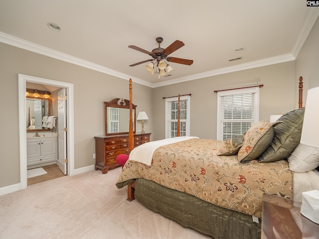 bedroom featuring baseboards, ornamental molding, a sink, and light colored carpet