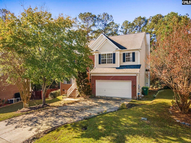 traditional-style house with a garage, brick siding, concrete driveway, and a front yard