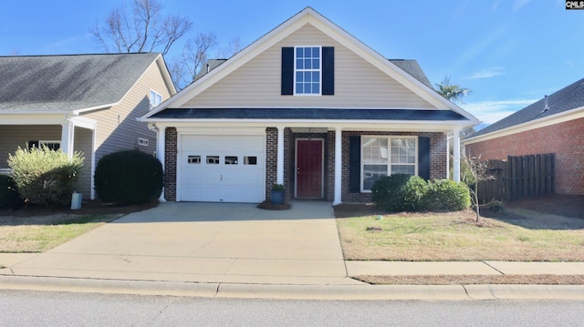 view of front of home featuring concrete driveway, an attached garage, covered porch, fence, and brick siding